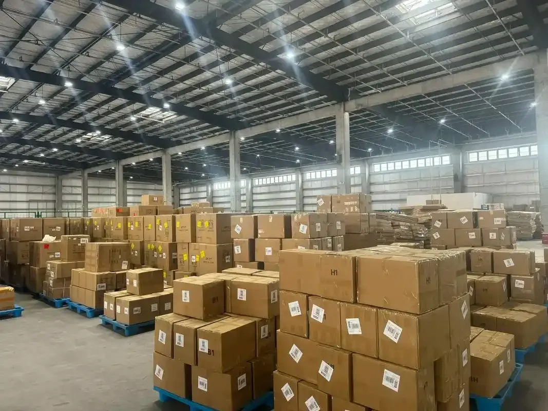 Cartons stacked on pallets inside a warehouse